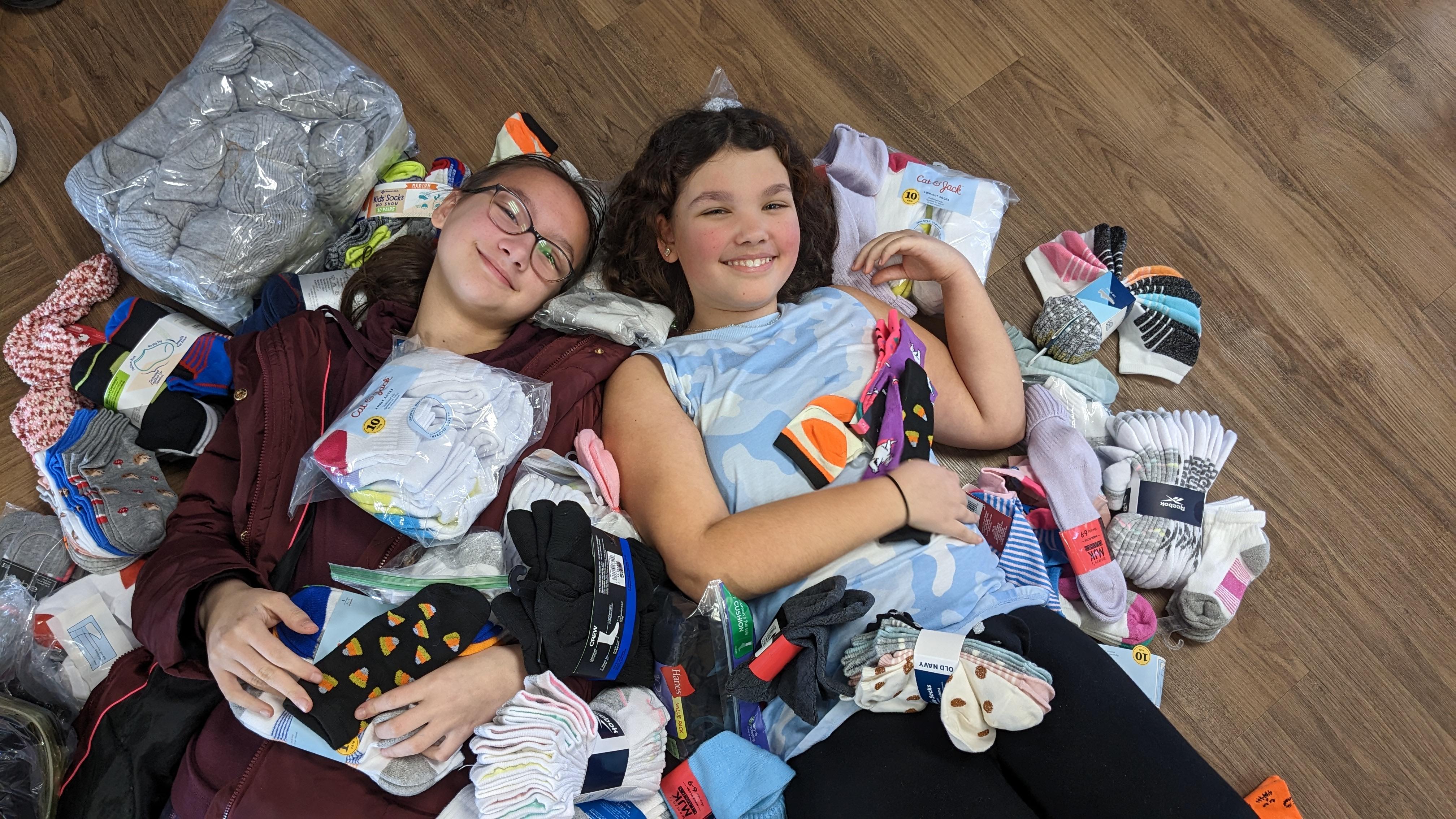 Center School Students laying in a pile of socks.